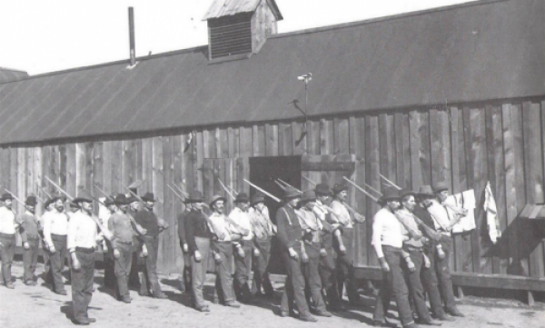 Western Federation of Miners, Idaho Bullpen 1899, marching with wooden guns. .png