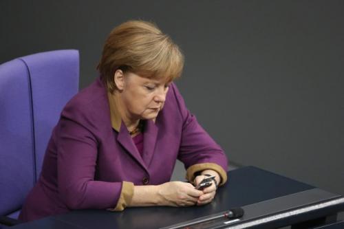 Merkel with cellphone - 185793196.jpg