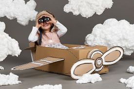 child-girl-plays-airplane-made-cardboard-box-dreams_cg2p43156214c_th.jpg