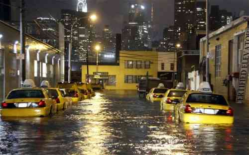 SUPERSTORM-SANDY- flooded taxi streetn in queens.jpg