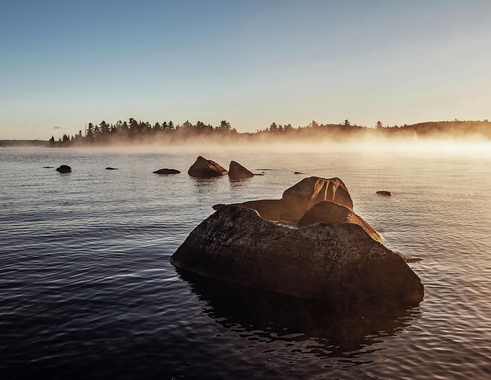 sunrise-over-rocky-misty-and-foggy-bald-mountain-pond-maine-cavan-images.jpg.png